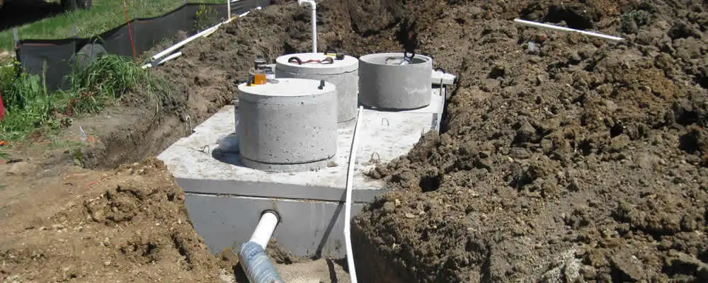 Septic system repair and installation site with tank access ports in Louisville, KY
