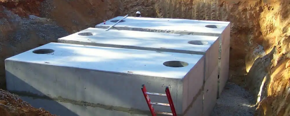 Septic tank installation site with a newly placed concrete tank in Louisville, KY